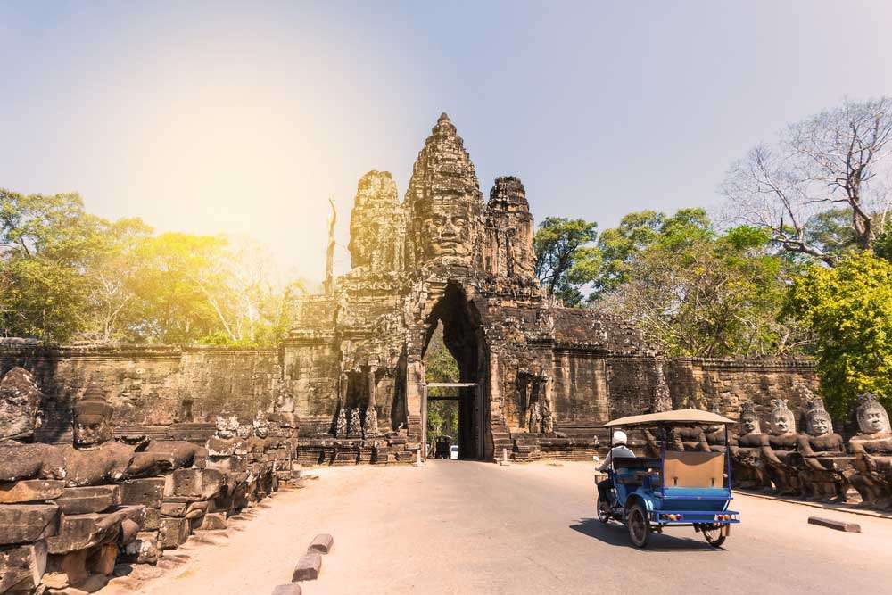 Cambodia siem reap tuk tuk and angkor thom gate