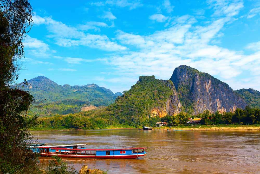 Laos luang prabang tour boats in mekong river