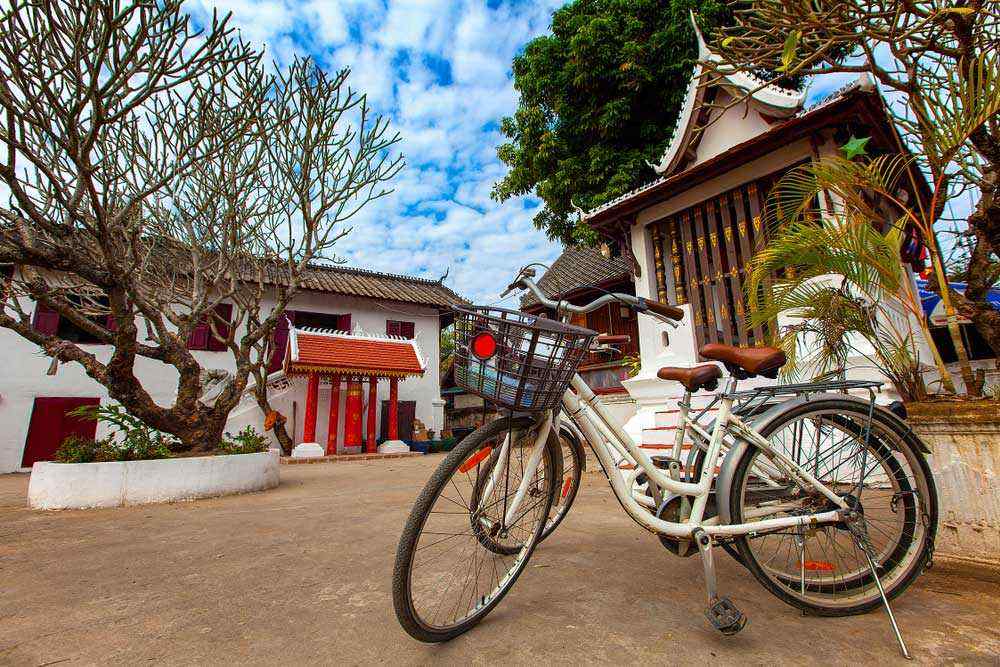 Laos luang prabang vintage bicycle in wat sensoukaram